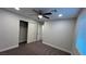 Well-lit bedroom with ceiling fan, closet, and carpet flooring at 4959 Idaho Ave, Las Vegas, NV 89104