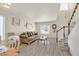 Living room with hardwood floors, staircase, and a couch at 9900 Rose Charmont St, Las Vegas, NV 89183