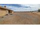 Large, open backyard with gravel and sparse desert landscaping at 891 Indole St, Pahrump, NV 89048