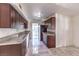 Clean kitchen, offering ample cabinetry, granite counters, and tile floors at 344 Yosemite St, Las Vegas, NV 89107