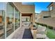 Relaxing patio with seating area and view of the backyard at 6411 Wild Blue Ct, Las Vegas, NV 89135