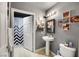 Stylish bathroom with pedestal sink, toilet and shower at 67 E Agate Ave # 401, Las Vegas, NV 89123