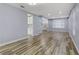 Spacious living room with wood-look floors and lots of natural light at 8774 Libertyvale Dr, Las Vegas, NV 89123