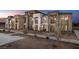 Modern three-story townhomes with private balconies and landscaped grounds at 1168 Ammonite Ave # Lot 44, Henderson, NV 89011