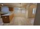 Kitchen with light wood cabinets and tiled floor at 3445 Blue Ash Ln, Las Vegas, NV 89122