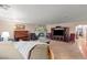 Spacious living room featuring a stone fireplace and built-in entertainment center at 3841 Hildebrand Ln, Las Vegas, NV 89121