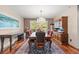 Formal dining room featuring hardwood floors, chandelier, and built-in hutch at 3841 Hildebrand Ln, Las Vegas, NV 89121