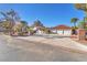 Luxury home exterior with three-car garage and manicured landscaping at 2868 Vista Del Sol Ave, Las Vegas, NV 89120