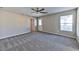 Spacious bedroom with ceiling fan and carpet at 6137 Talbot Springs Ct, North Las Vegas, NV 89081