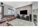 Spacious living room featuring a fireplace and large TV at 9209 Dalmahoy Pl, Las Vegas, NV 89145