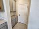 Walk-in pantry with built-in shelving and grey cabinetry at 9398 Ara Place, Las Vegas, NV 89143