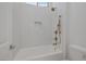 Modern bathroom with a white penny tile shower and bathtub at 2230 Pigeon Hawk St, Las Vegas, NV 89138