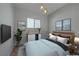 Serene bedroom with light wood bed and blue bedding at 2230 Pigeon Hawk St, Las Vegas, NV 89138