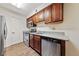 Well-equipped kitchen featuring stainless steel appliances and wood cabinets at 2451 N Rainbow Blvd # 1086, Las Vegas, NV 89108