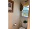 Small bathroom with toilet, window, and decorative window treatment at 122 Broken Putter Way, Las Vegas, NV 89148