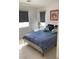 Bedroom with a double bed, blue bedding, and neutral decor at 122 Broken Putter Way, Las Vegas, NV 89148