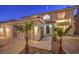 Two story home with landscaped yard and two car garage at 527 Leap Frog Ave, Las Vegas, NV 89183