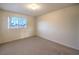 Simple bedroom with neutral wall and carpet flooring at 527 Leap Frog Ave, Las Vegas, NV 89183