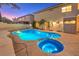 Inviting backyard oasis featuring a sparkling pool and spa, perfect for relaxation and entertaining at 527 Leap Frog Ave, Las Vegas, NV 89183