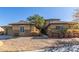 Two-story house with stone accents and landscaped front yard at 32 Hassayampa Trl, Henderson, NV 89052