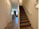 Carpeted staircase leading to upper level at 4273 Venus Falls Ave, North Las Vegas, NV 89084