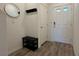 Inviting entryway with a shoe bench and coat rack at 4273 Venus Falls Ave, North Las Vegas, NV 89084