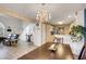 Open dining area with a view of the living room and kitchen at 7705 Allano Way, Las Vegas, NV 89128