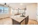 Kitchen island with granite countertop and stainless steel sink at 928 Crescent Falls St, Henderson, NV 89011