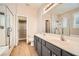 Bathroom with double vanity, shower, and soaking tub at 928 Crescent Falls St, Henderson, NV 89011