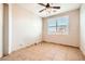 Spacious bedroom with tile floors and ceiling fan at 928 Crescent Falls St, Henderson, NV 89011