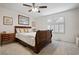 Well-lit bedroom with a sleigh bed and decorative accents at 4416 Lilac Glen Dr, Las Vegas, NV 89129