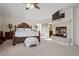 Spacious Primary bedroom with fireplace and large bed at 4416 Lilac Glen Dr, Las Vegas, NV 89129