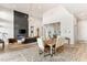 Elegant dining area with hardwood floors and a large farmhouse table at 5184 Steel Hammer Dr, Las Vegas, NV 89135