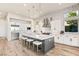 Modern kitchen with white cabinetry, large island and stainless steel appliances at 5184 Steel Hammer Dr, Las Vegas, NV 89135