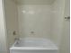 Bathroom with a bathtub and textured wall at 9720 Pan Falls St, Las Vegas, NV 89178