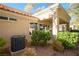 Backyard patio area with AC unit and mature landscaping at 2904 Linkview Dr, Las Vegas, NV 89134