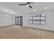 Bright and airy living room with hardwood floors and sliding glass doors at 3119 Trueno Rd, Henderson, NV 89014