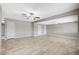 Bright living room featuring tile floors and ceiling fans at 3437 Nipper St, North Las Vegas, NV 89030