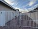 Gravel backyard with gated entryway at 617 Hidden Valley Dr, Henderson, NV 89002