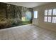 Living room with tile floors and scenic wall mural at 617 Hidden Valley Dr, Henderson, NV 89002