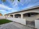 Covered patio with artificial turf and brick pavers at 617 Hidden Valley Dr, Henderson, NV 89002