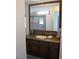 Bathroom with single vanity and large mirror at 1529 Villa Rica Dr, Henderson, NV 89052