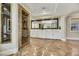 Bright bathroom with double vanities and marble floors at 1529 Villa Rica Dr, Henderson, NV 89052