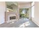 Bright living room with fireplace and sliding glass doors leading to a patio at 4916 Mount Pleasant Ln, Las Vegas, NV 89113