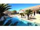 Inviting pool and spa area with pergola and lush landscaping at 735 Diamond Bend Ave, Las Vegas, NV 89123