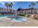 Community pool and spa with lounge chairs at 700 Carnegie St # 2621, Henderson, NV 89052