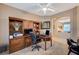 Bright home office with built-in wooden desk and shelving at 4729 Regalo Bello St, Las Vegas, NV 89135