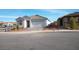 Newly built home with a two-car garage and landscaped front yard at 705 Icy Fjord Ln, Henderson, NV 89015