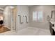 Bright bathroom with marble flooring and access to other rooms at 132 Dunblane St, Henderson, NV 89012