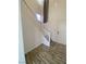 Clean, white staircase with simple wood railing at 7984 Dardanelle Valley St, Las Vegas, NV 89139